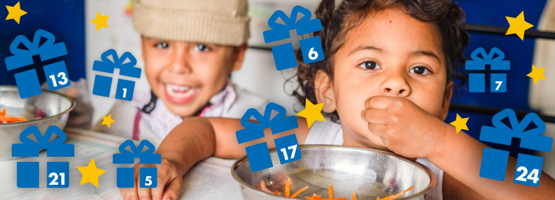 Kinder essen mit den Händen und Adventskalender-Geschenke