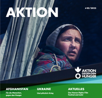 Unser Magazin Aktion Nummer 2/2022 zeigt ein Bild einer ukrainischen Frau in einem Bus